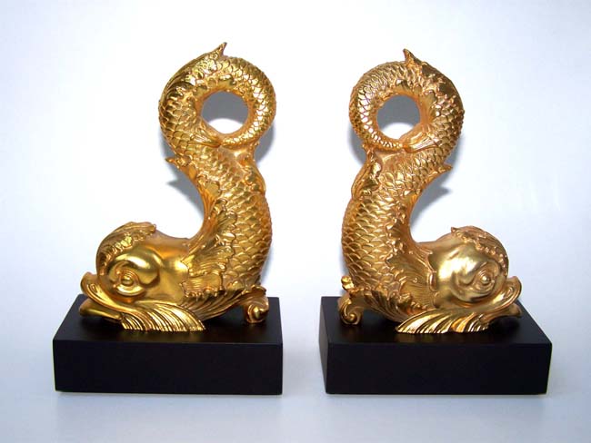 A beautiful pair of gold-leafed Antique 'Style' Bookends depicting late 18th century Dolphins